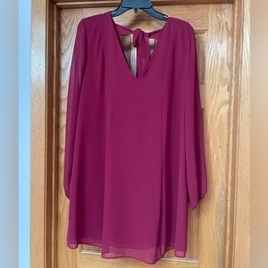 BCBG dress with sheer sleeves and ribbon tie back.